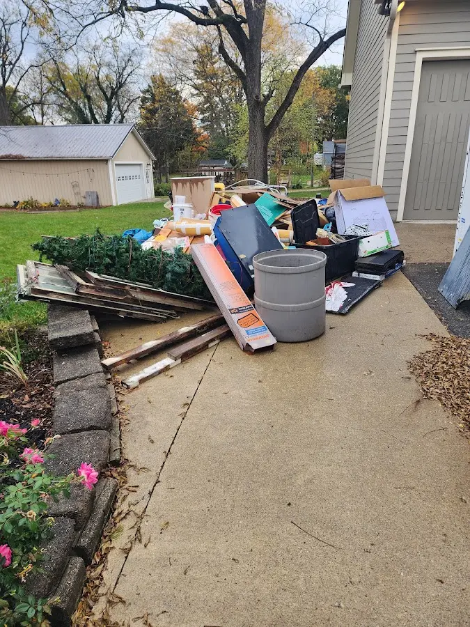 Dumpster being loaded with debris for Roofing Dumpster Rental in Doctor Phillips